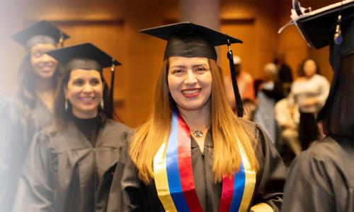 Herzing Colorado Online BSN Student Smiling at Graduation Ceremony 