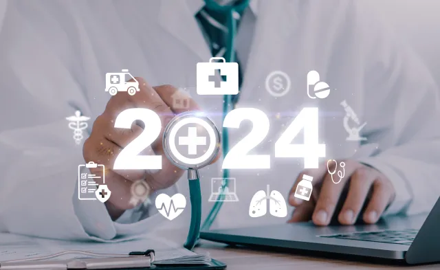 Doctor holding end of stethoscope with 2024 superimposed on top