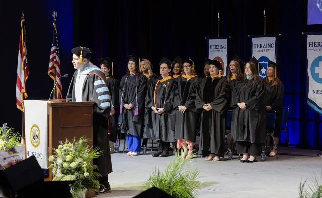 Herzing Akron faculty and leadership observing commencement ceremony
