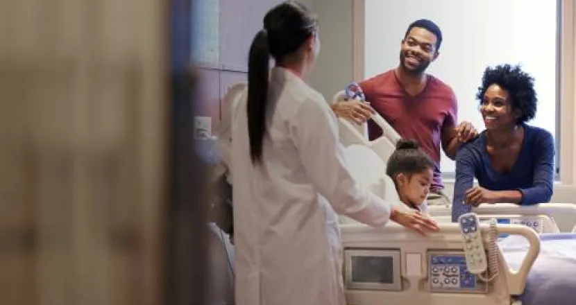 Herzing Nursing Programs MSN Prepared Nurse Practitioner Discussing Diagnosis with Family