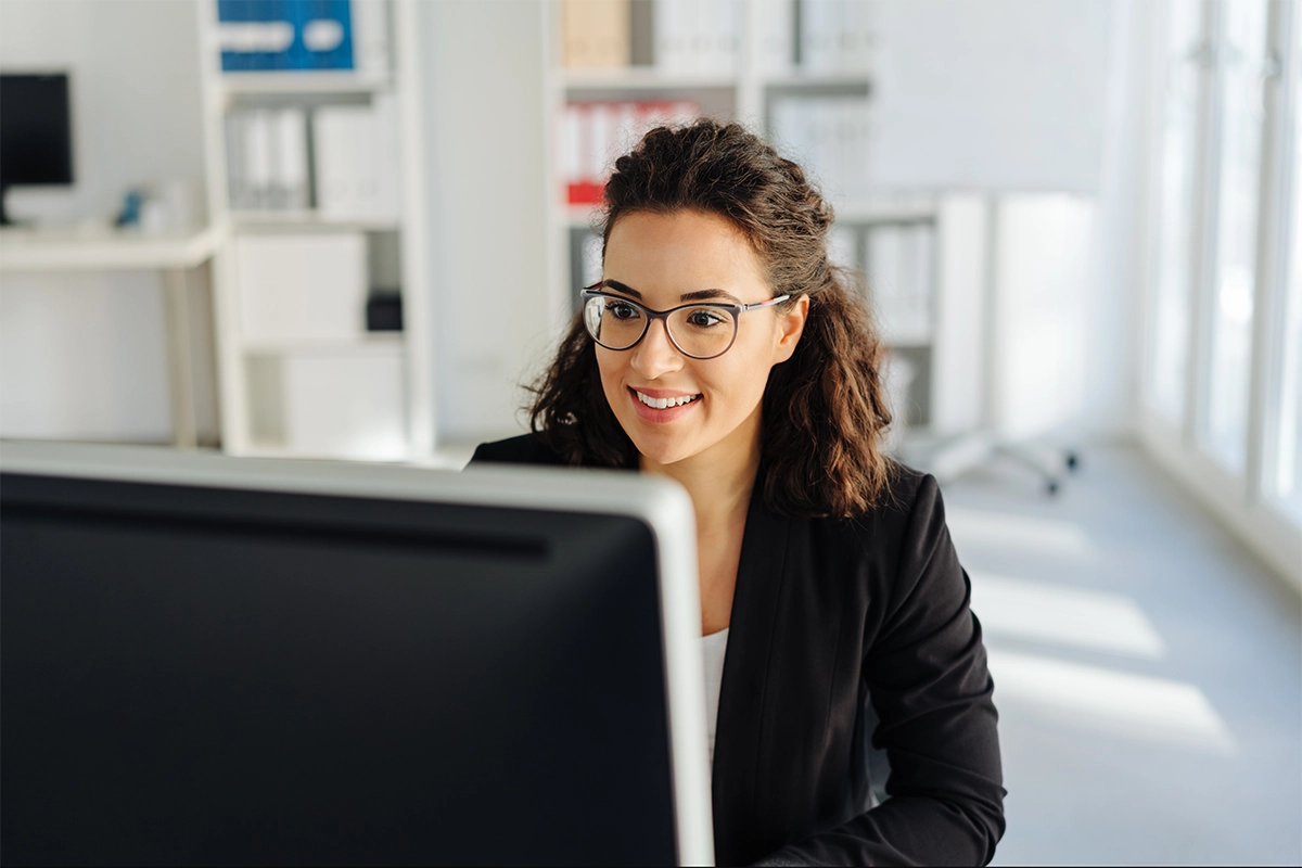 Medical coder working at desk