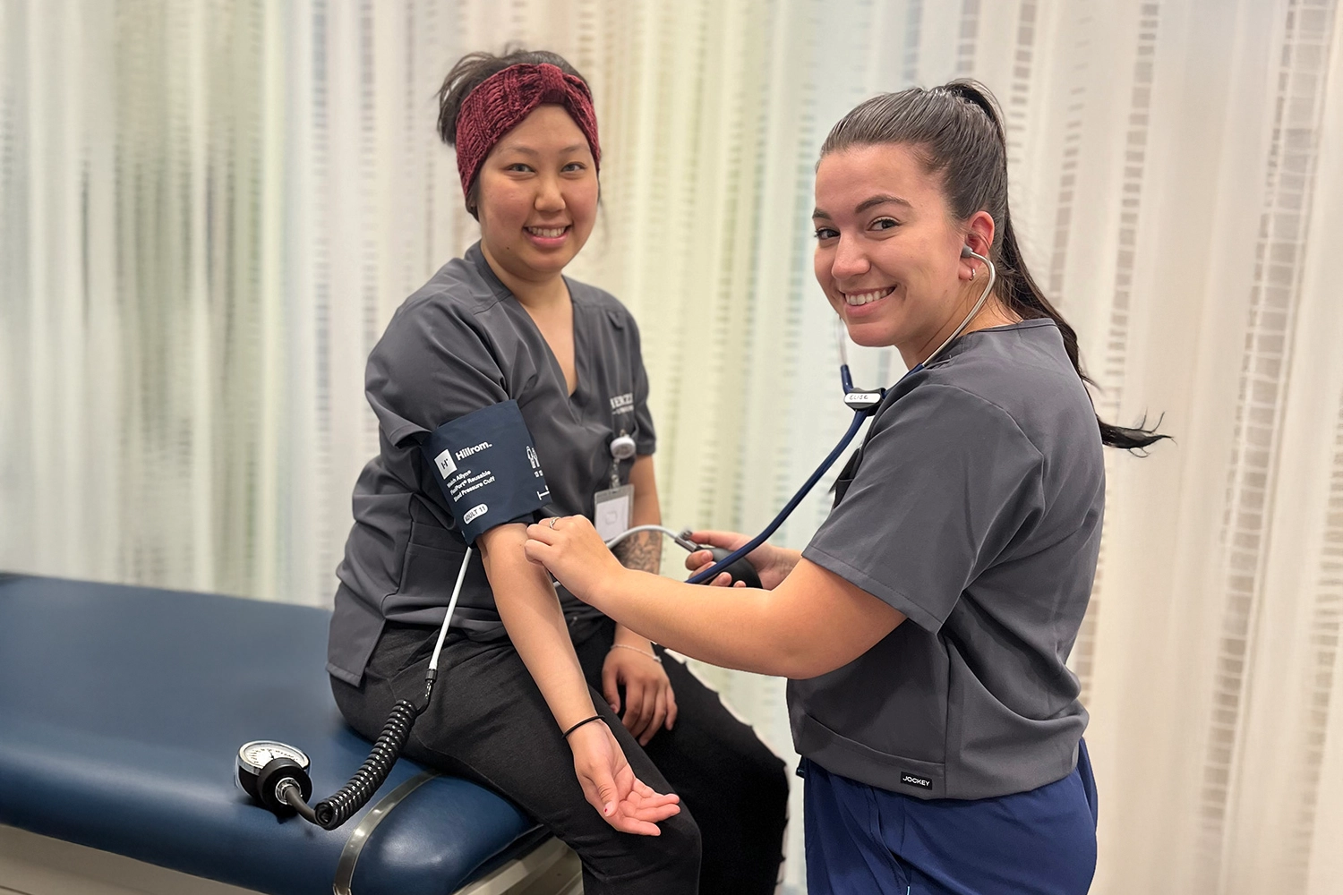 MA students checking a blood pressure