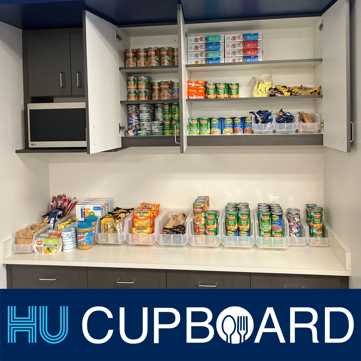 Herzing University HU Cupboard student food pantry with canned goods, snacks, and essential supplies