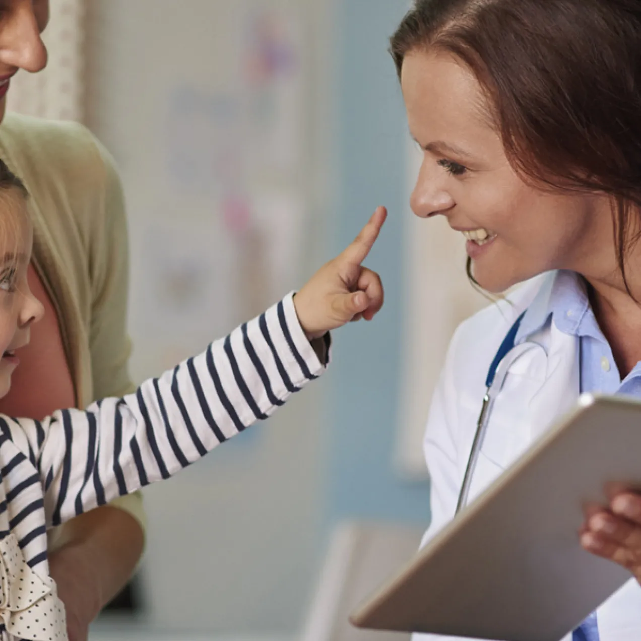 Nurse Practitioner Smiling with Pediatric Patient