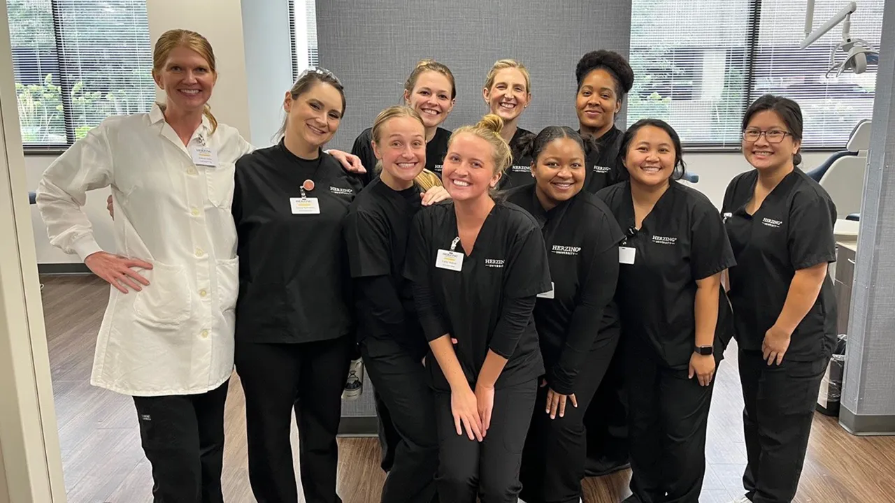 Herzing Dental Hygiene students with their instructor pose for a photograph