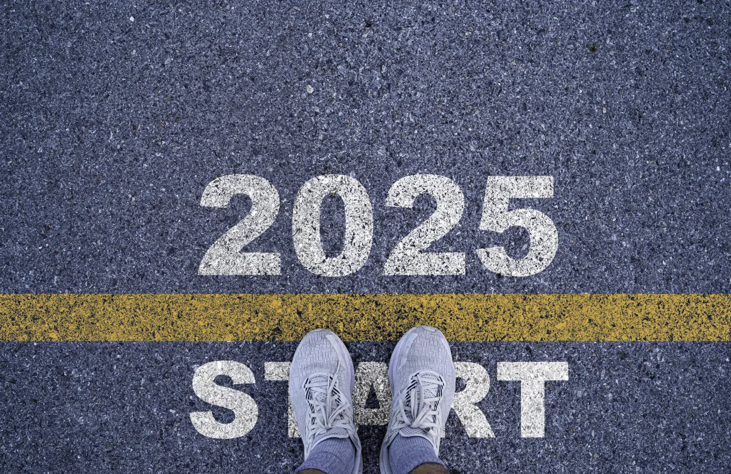 Runner standing at the starting point with 2025 year for starting in new year 2025 to achieve business planning and success concept.