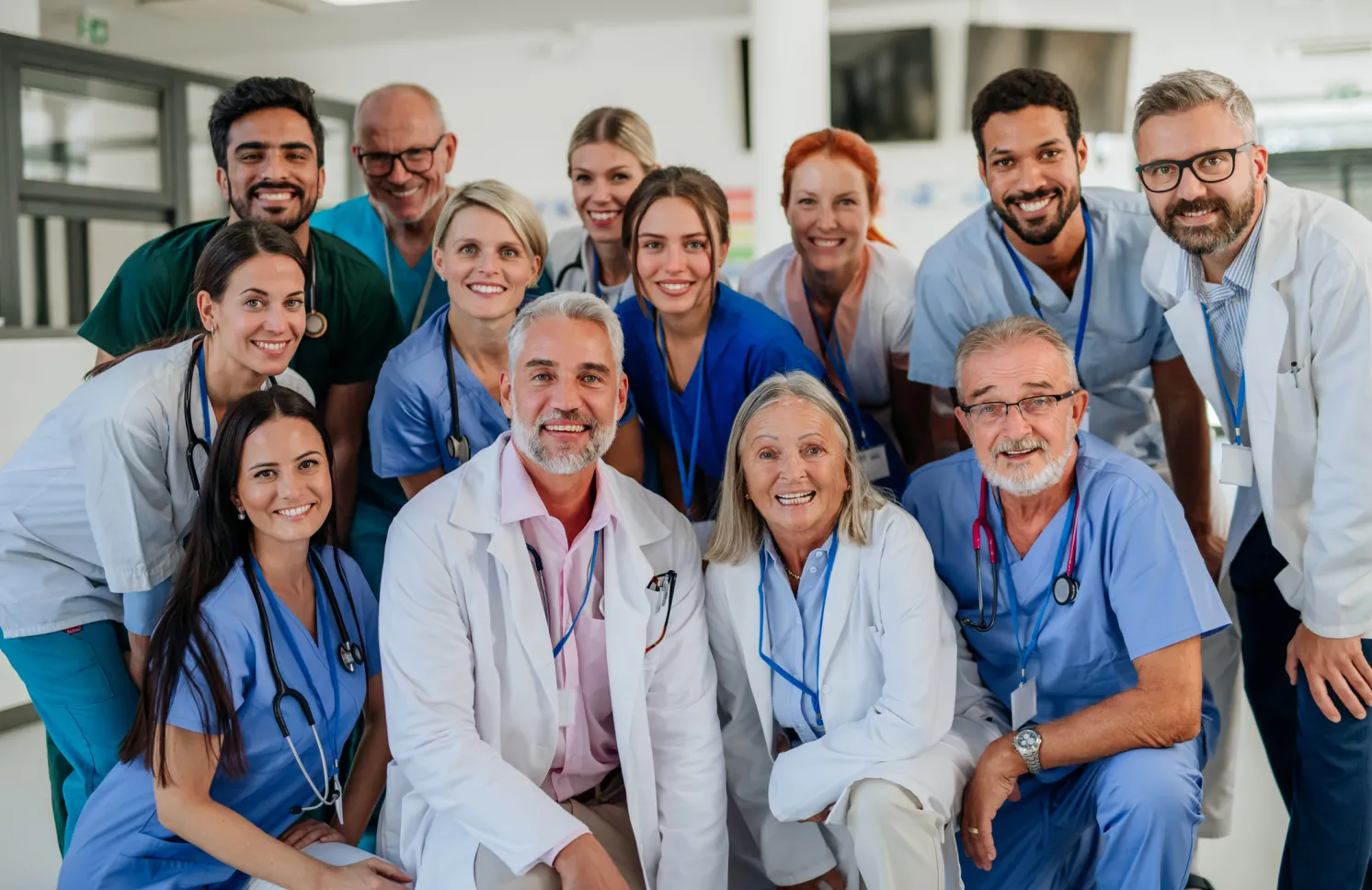 Portrait of happy doctors, nurses and other medical staff in a hospital.