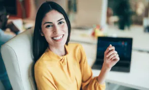 Professional stock trader monitoring stock prices and financial data in a modern trading office environment. Represents investment strategy and market performance.