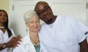 James Wanjiru smiling with patient Ms. Small