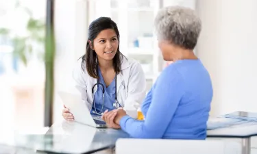 Family Nurse Practitioner with MSN Speaking with Patient