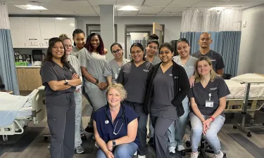 Group of Herzing Tampa nursing students participating in laboratory simulation experience