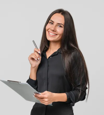 Smiling professional woman holding a clipboard and pen, representing a career in health information management.