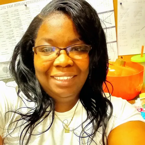 African American women taking a selfie in an office setting