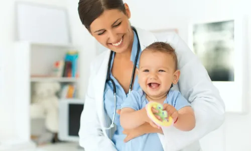 Pediatric nurse practitioner smiling with patient