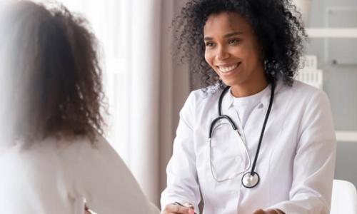 Mental health nurse smiling and engaging with a patient