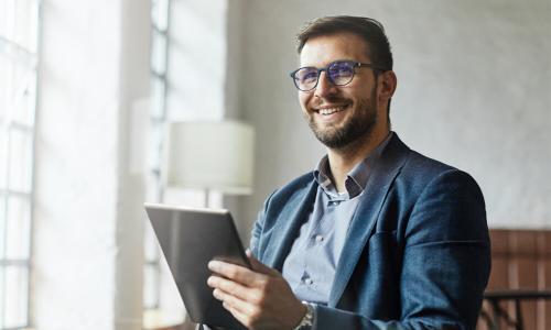 Business analyst from Georgia who graduated with MBA smiling in business meeting 