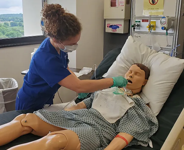 Nursing student in sim lab