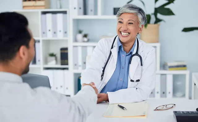 Public Health Nurse Shaking Hands with Nurse Manager