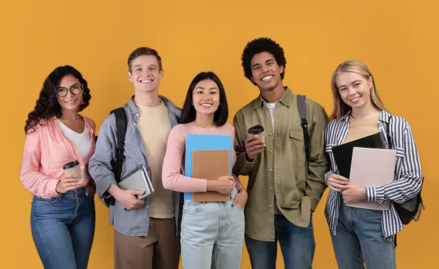 Five college students holding notebooks and folders