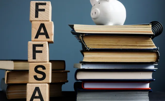 FAFSA Free application for federal student aid. Letters on the cubes.