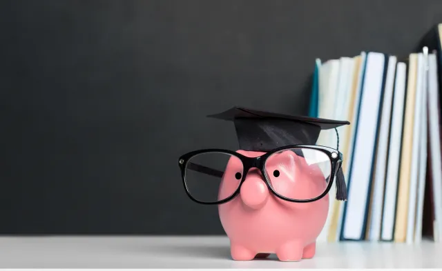 College graduate student diploma piggy bank