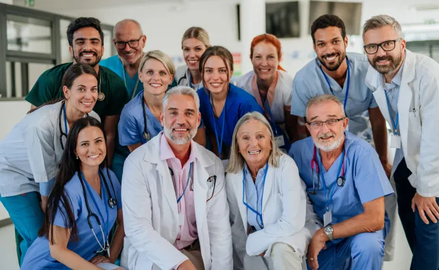 Portrait of happy doctors, nurses and other medical staff in a hospital.