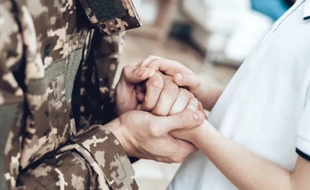 A Man Goes To Military Service. Saying Goodbye. Leaving To Army. Farewell With Family. Camouflage Uniform. Son Hanging. Feelings Showing. Guard Of Peace. Patriotic Decision. Soldier Emotion.