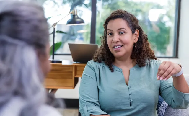 Doctor of Behavioral Health clinician conducting a counseling session with a patient