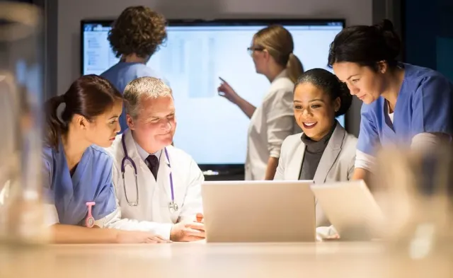 Team of nursing administrators and managers in meeting discussing hospital needs