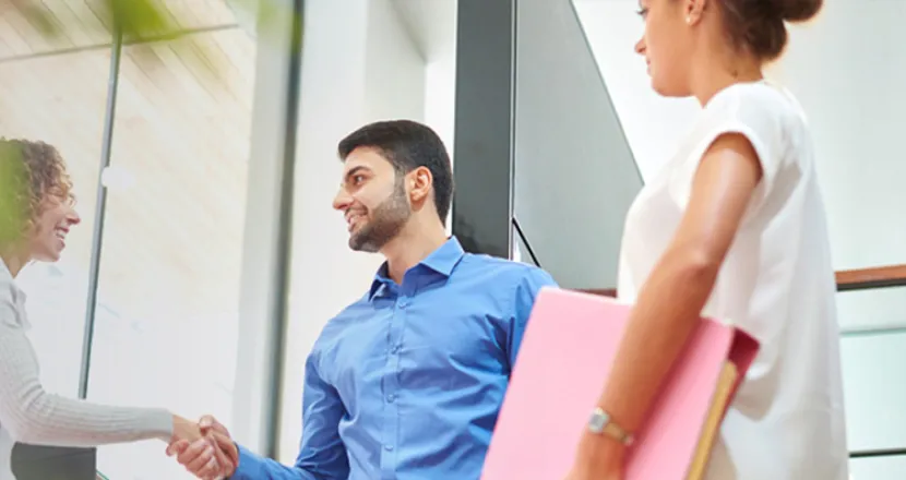 Business Entrepreneurship Bachelor Degree Program Graduate Shaking Hands with Operations Manager