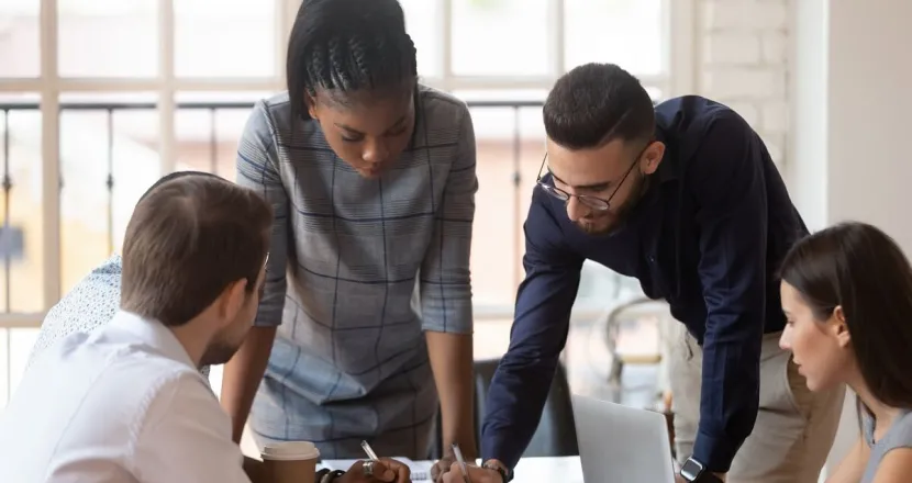 Business manager in meeting with co-workers