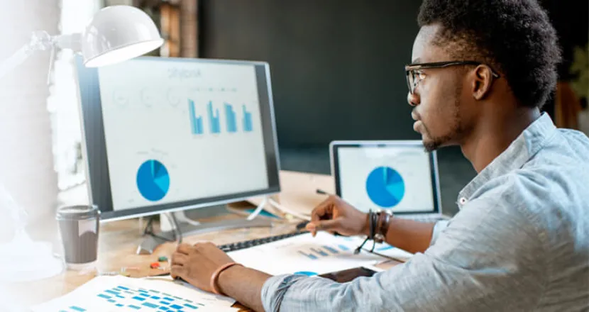 Data Analytics Student Analyzing Graphs on Computer