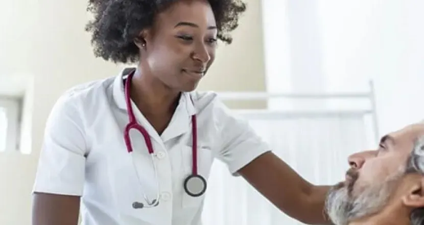 Acute Care Nurse Practitioner Caring for Male Adult Patient in Hospital