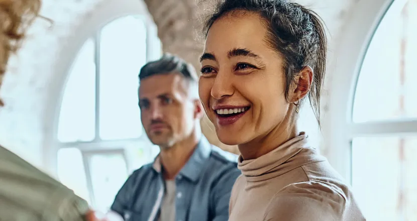 Health and Human Services Worker Smiling at Patient with Hand on Shoulder