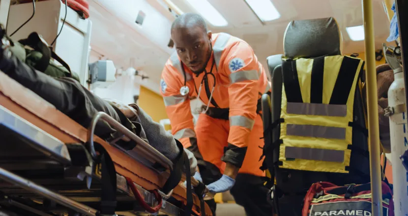 EMT Emergency Medical Technician Loading Patient Into Ambulance