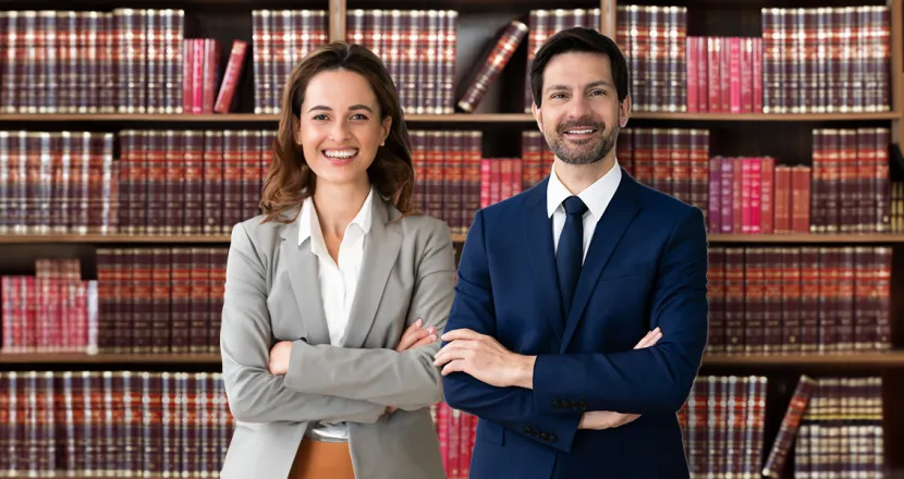 Legal studies graduates in library working as paralegals