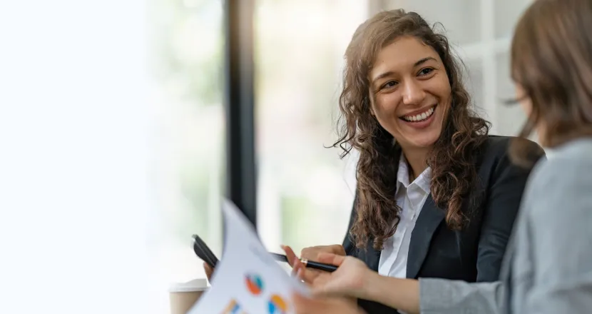 Project manager with bachelor's degree smiling during meeting