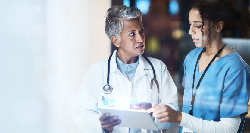 DNP AGACNP Nurse Badge Banner Acute care nurse practitioner with DNP reviewing treatment with RN