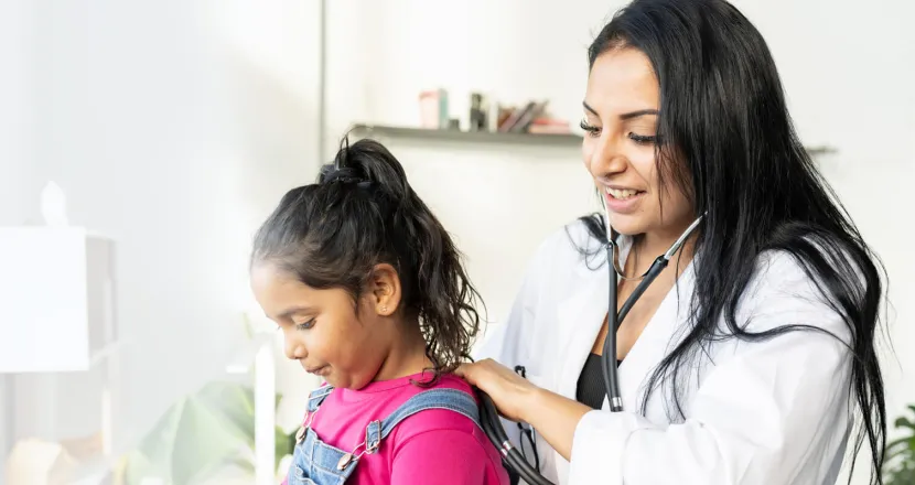 DNP Pediatric Nurse Practitioner Badge Banner Pediatric nurse practitioner with DNP working with young patient