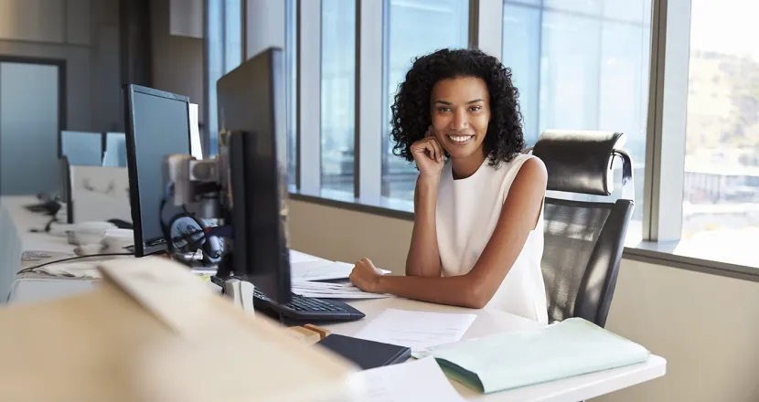 Healthcare professional reviewing medical billing and coding documents on a desk.