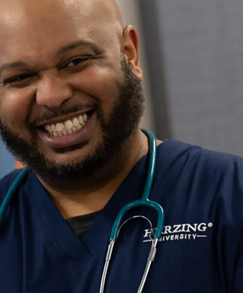 Male Paramedic to BSN Student Smiling in Nashville Nursing Simulation Lab