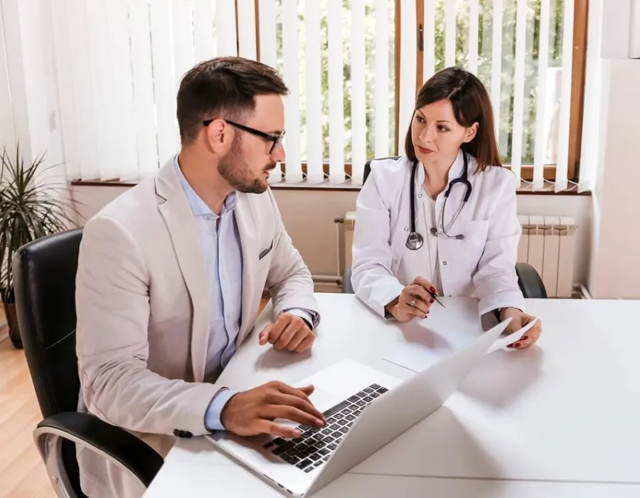 Two healthcare administrators in meeting discussing hospital needs