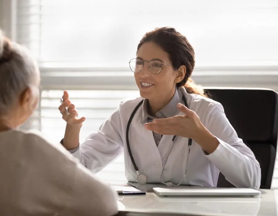 Nurse Practitioner Discussing Treatment Options with Adult Patient