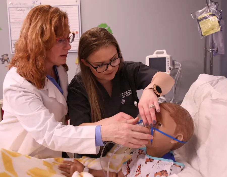 LPN to RN Student in Simulation Lab with Nursing Instructor