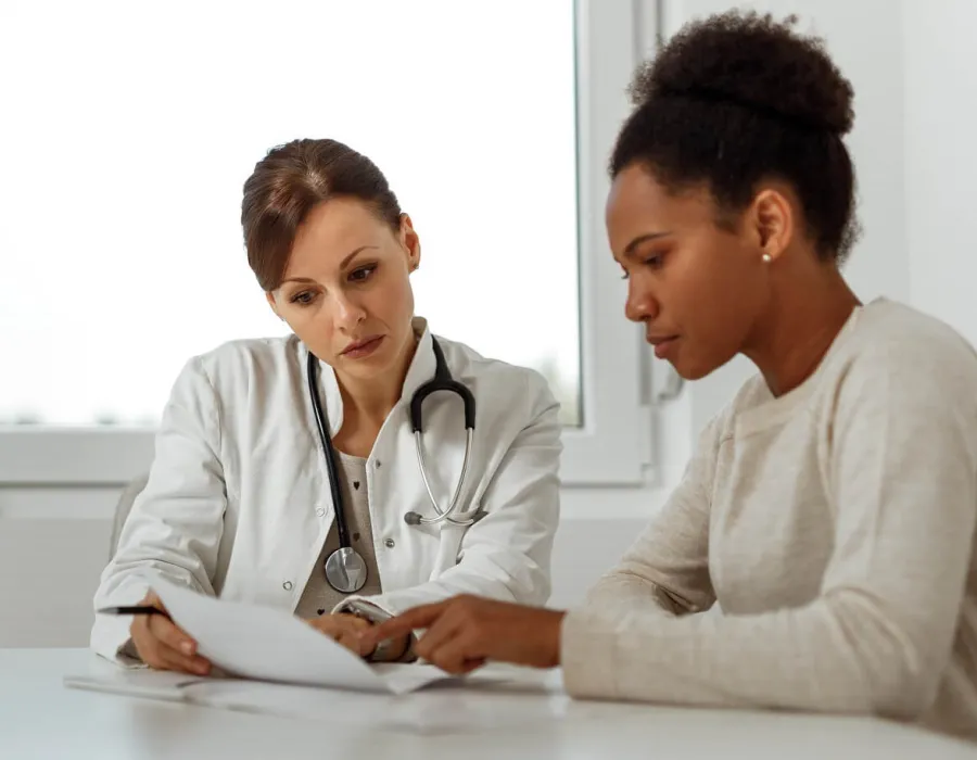 MSN DNP Nurse Practitioner Consulting Diagnosis with Patient