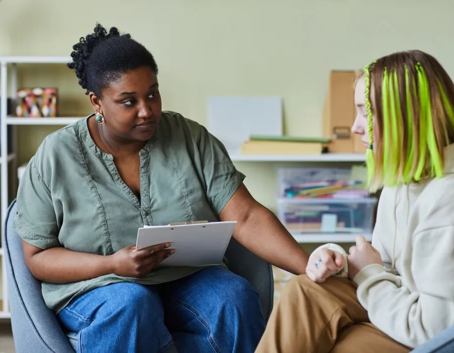 Social Worker Speaking with Young Client