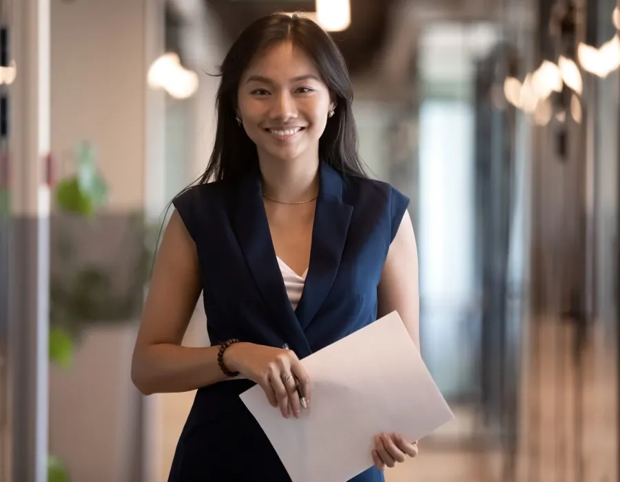 Human Resources HR Manager Smiling with Notes for Meeting