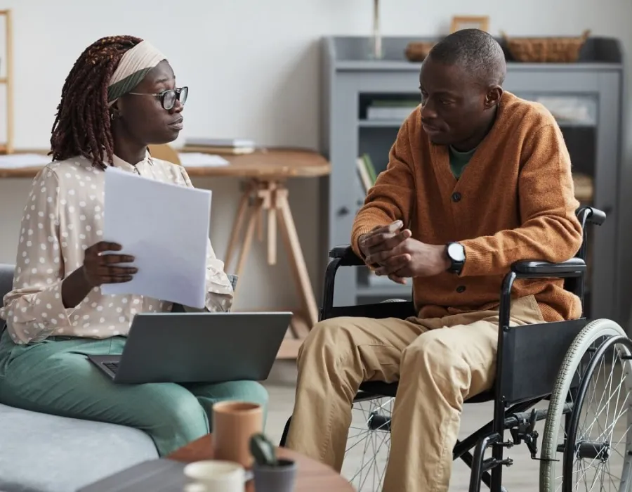 Human Services Worker Discussing Social Services with Client