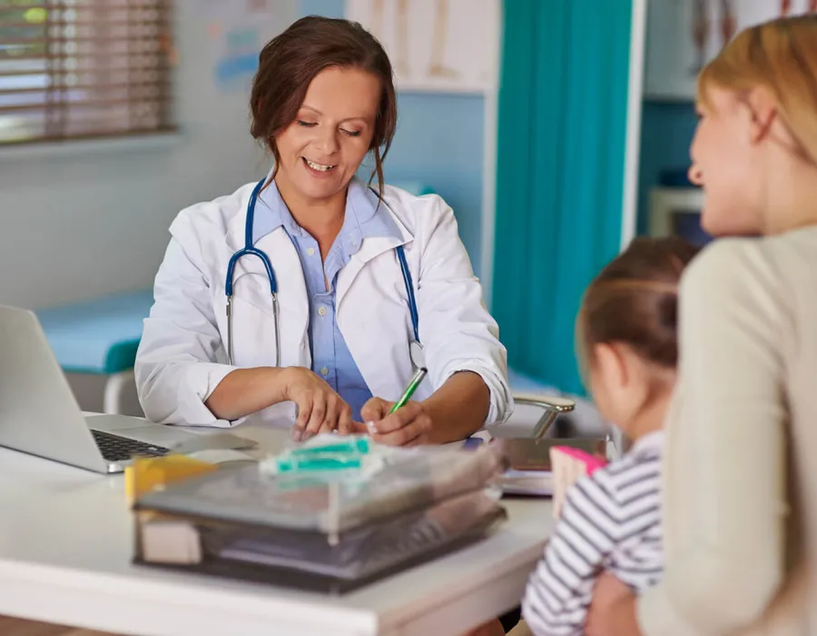 Pediatric Primary Care Nurse Practitioner Diagnosing Child Patient