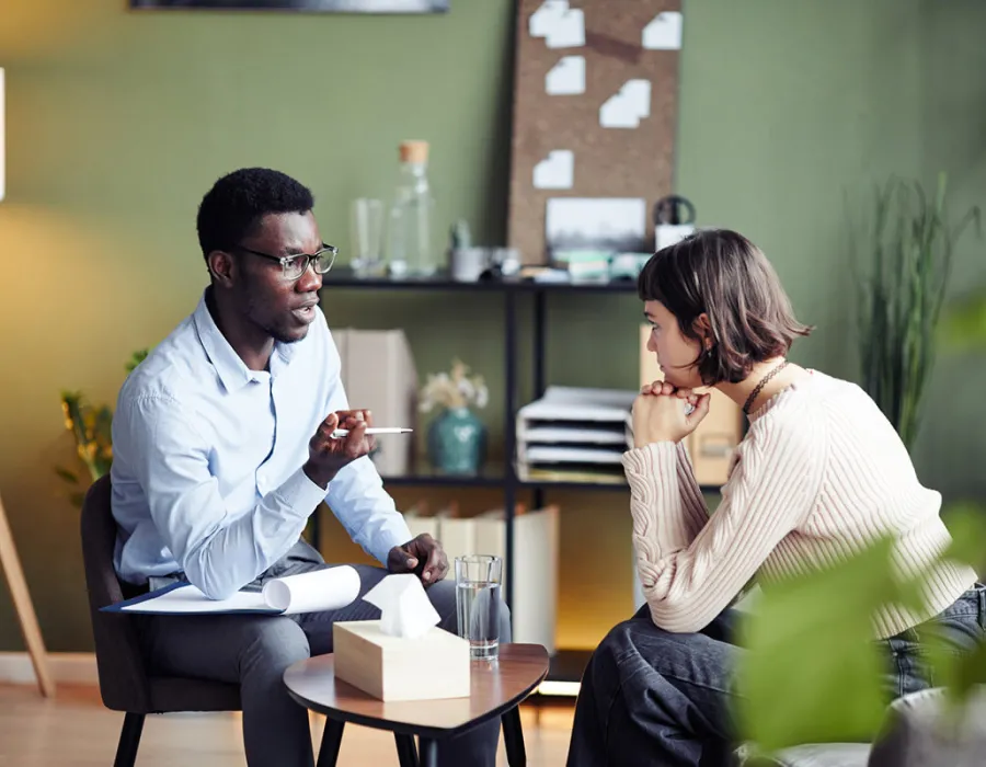 Psychology Degree Graduate Speaking with Client